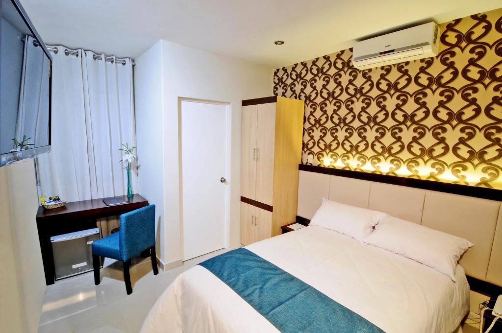 Postel nebo postele na pokoji v ubytování Dom Hotel