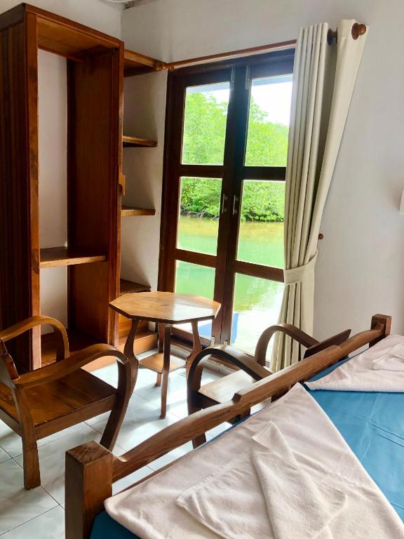Postel nebo postele na pokoji v ubytování Baan Chan Lay Koh Chang