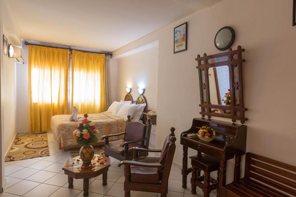Postel nebo postele na pokoji v ubytování Hotel Sindibad