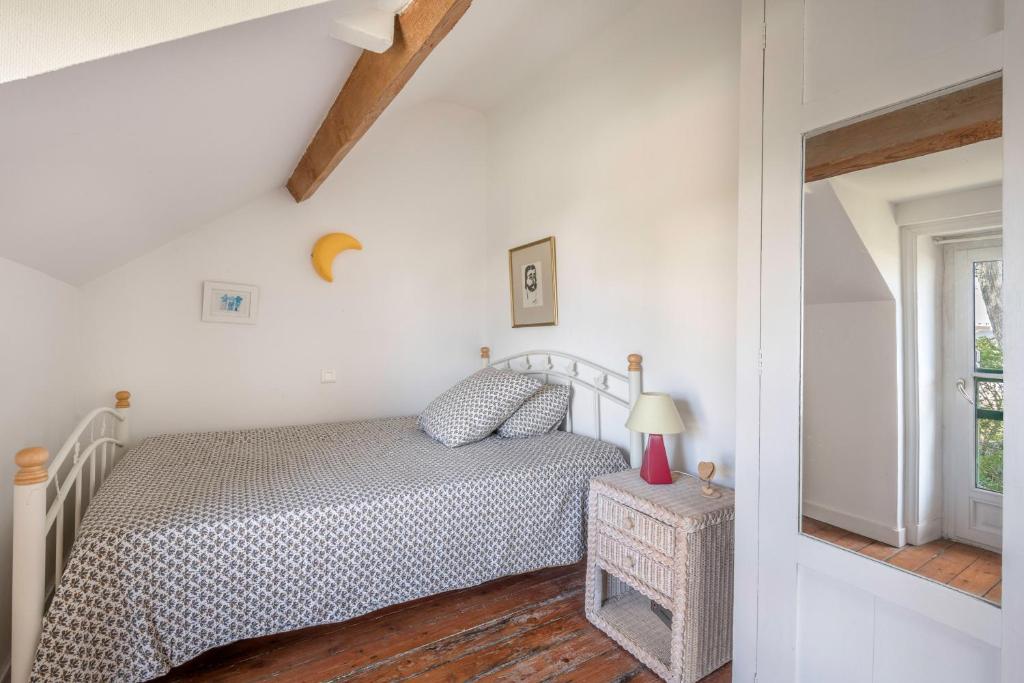 Posteľ alebo postele v izbe v ubytovaní Maison de caractère à 100 mètres de la plage