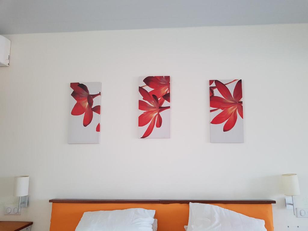 Postel nebo postele na pokoji v ubytování Hôtel DOUCE VAGUE