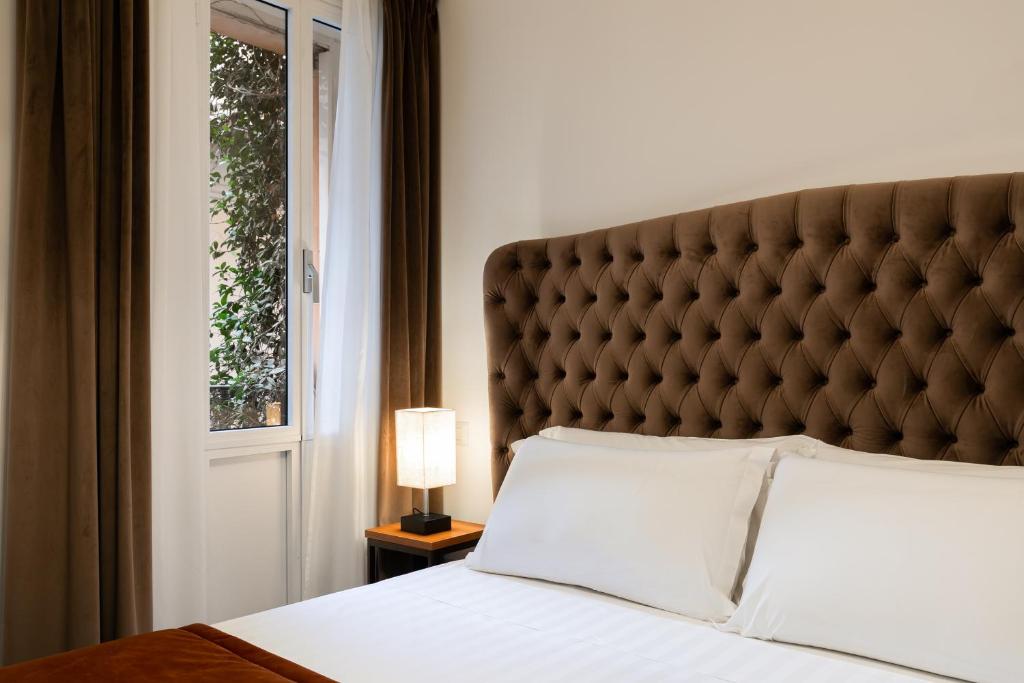 Ένα ή περισσότερα κρεβάτια σε δωμάτιο στο Relais del Portico