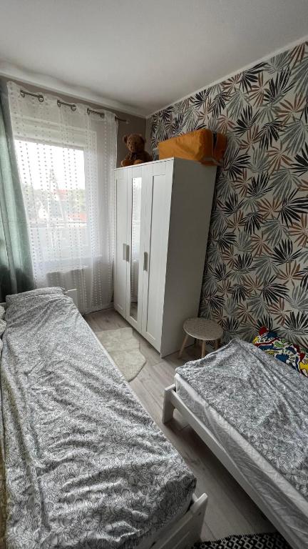 Posteľ alebo postele v izbe v ubytovaní Wypoczynek w Jantarze