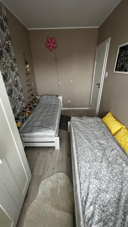Posteľ alebo postele v izbe v ubytovaní Wypoczynek w Jantarze