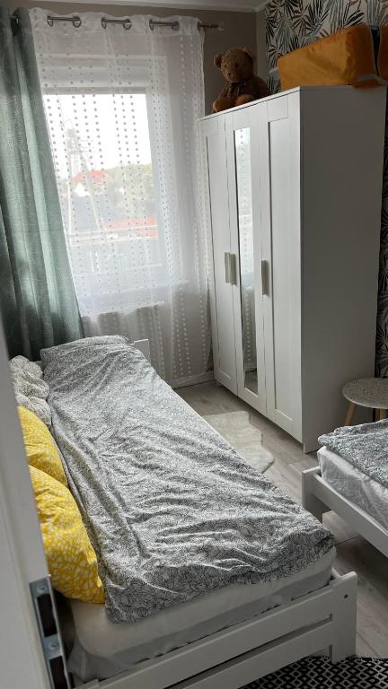Posteľ alebo postele v izbe v ubytovaní Wypoczynek w Jantarze
