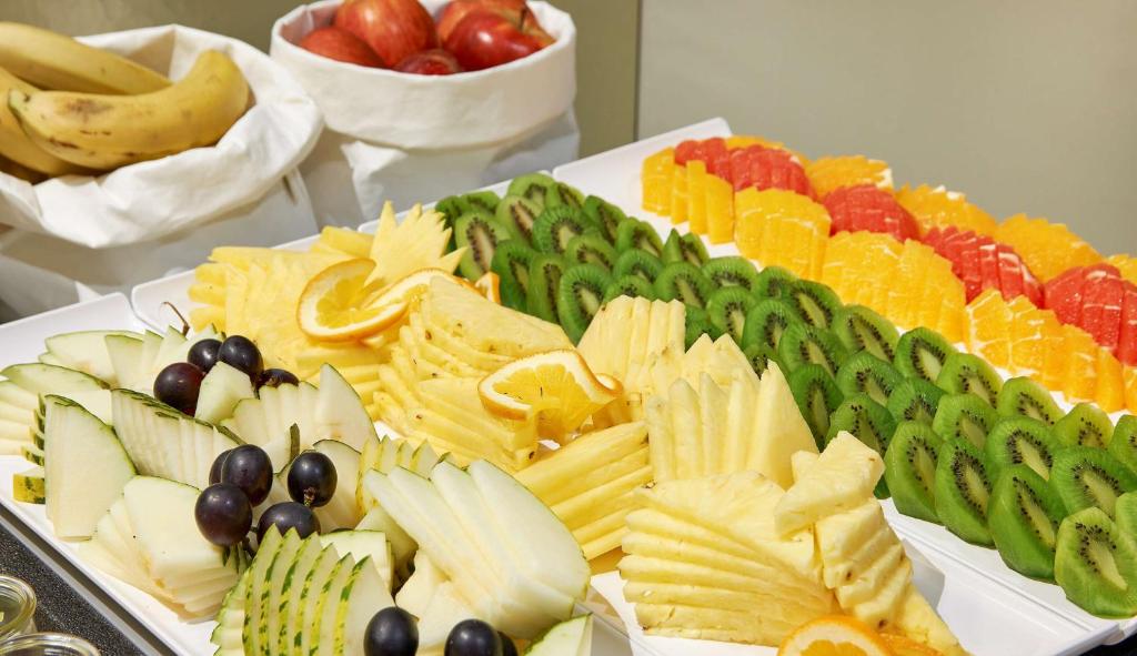 a platter of different types of food on a table at NH Collection Marseille in Marseille