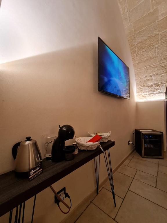 TV a/nebo společenská místnost v ubytování Suite Il Vico
