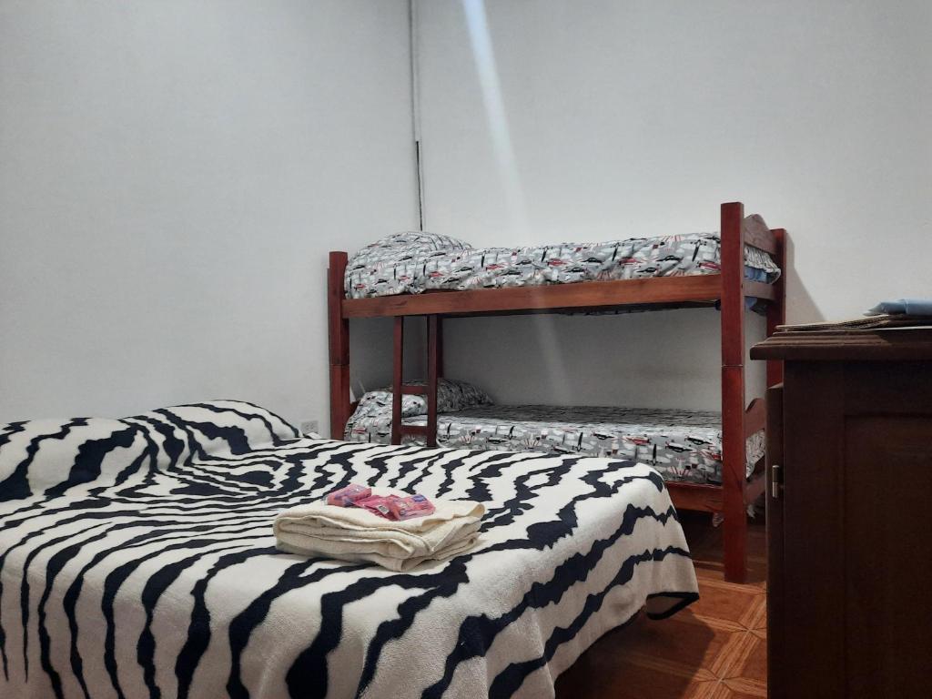 two bunk beds sitting in a room with at Terencio in Goya
