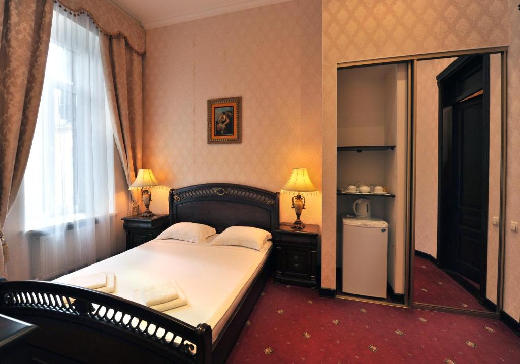 Postel nebo postele na pokoji v ubytování Oreanda Hotel