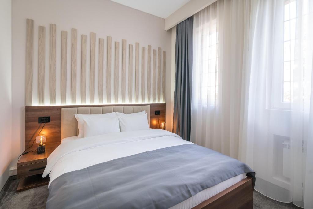 Postel nebo postele na pokoji v ubytování Veneti Suites