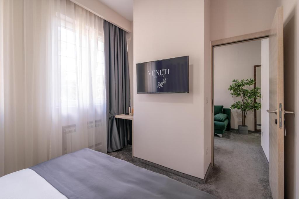 TV a/nebo společenská místnost v ubytování Veneti Suites