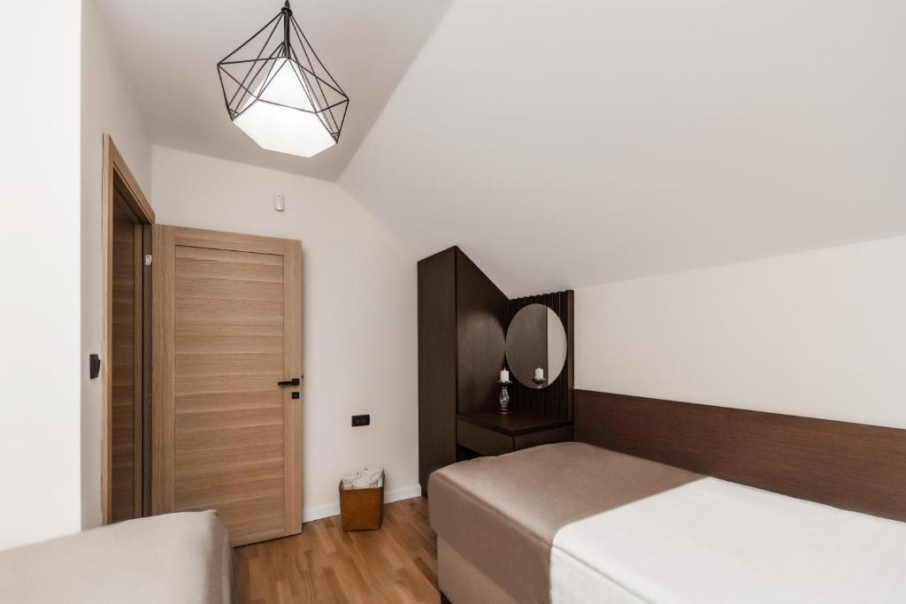 Postel nebo postele na pokoji v ubytování Villa Inverno & Spa