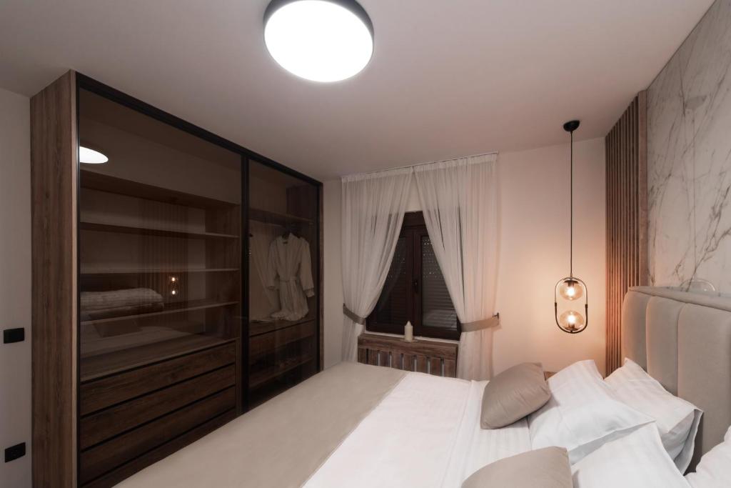 Postel nebo postele na pokoji v ubytování Villa Inverno & Spa