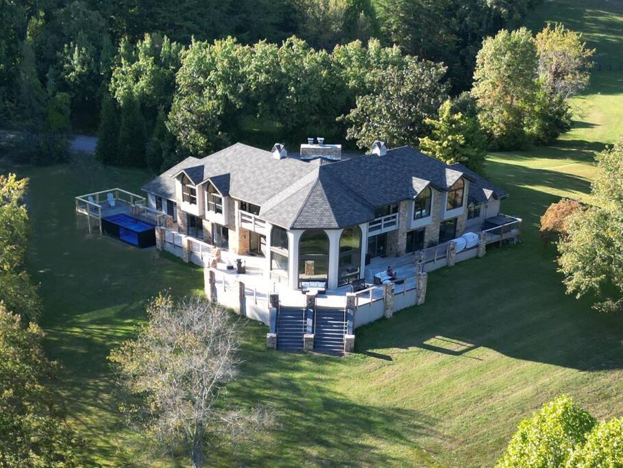 an aerial view of a large house on a lawn at Crestview Estate 5 acres-heated pool-5min to strip in Pigeon Forge