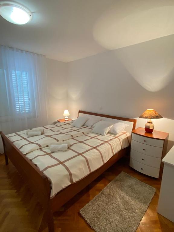 Postel nebo postele na pokoji v ubytování Apartment Tina