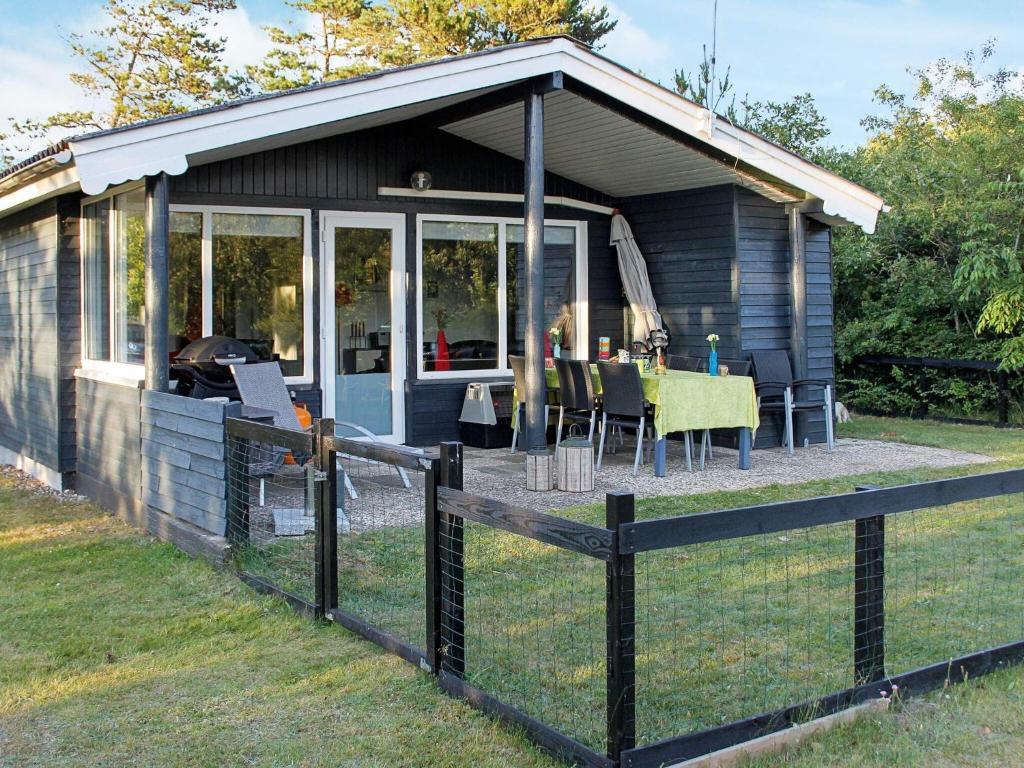 a small cabin with a table and chairs in it at 6 person holiday home in Skjern in Skjern