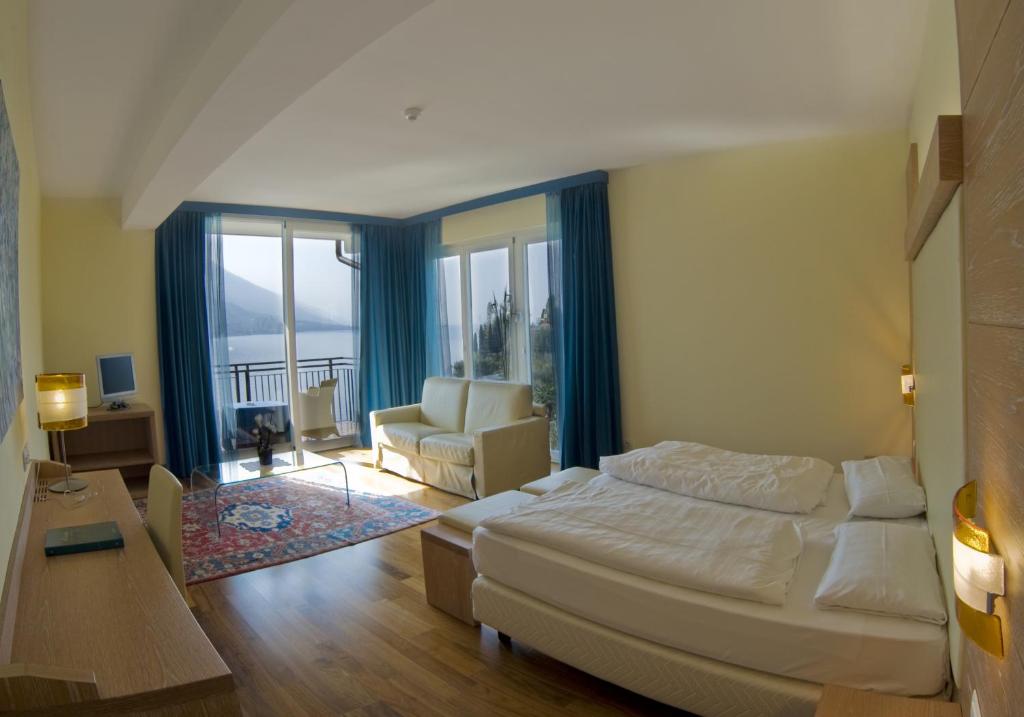 Postel nebo postele na pokoji v ubytování Hotel Maximilian