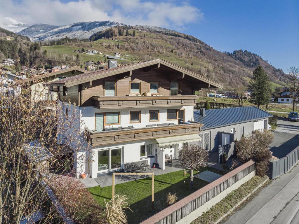 an aerial view of a house with mountains in the background at Studio 7 in Niedernsill