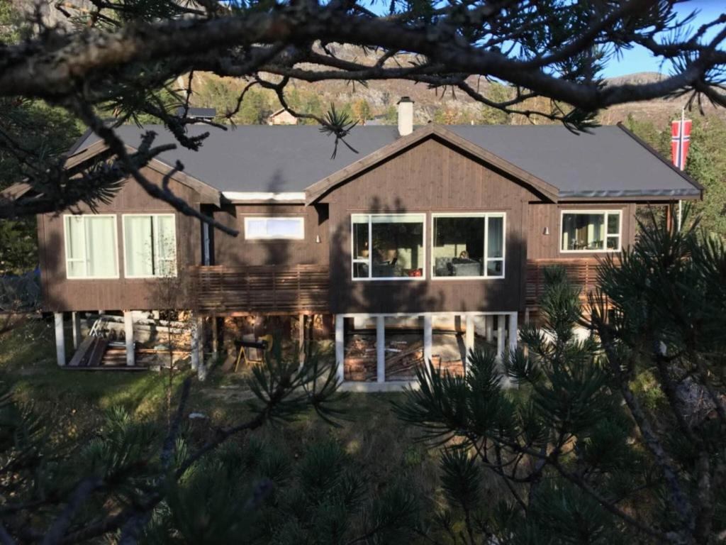 a large house with a roof at Holiday home Skare in Skare