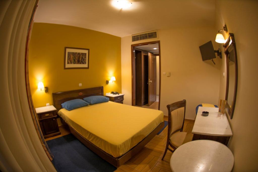 Postel nebo postele na pokoji v ubytování Hotel Chris