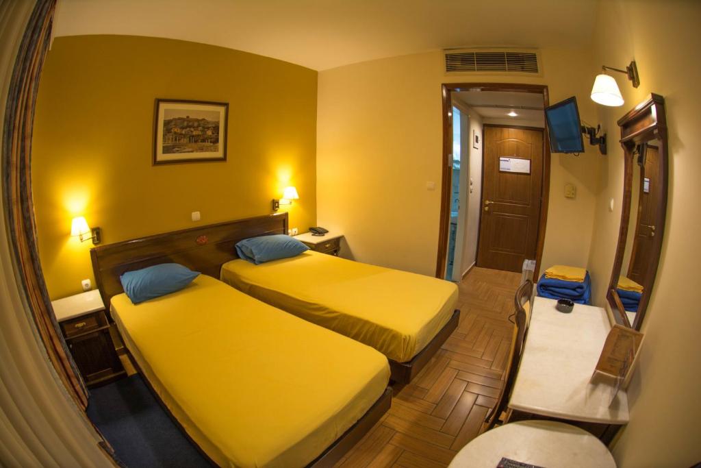 Postel nebo postele na pokoji v ubytování Hotel Chris