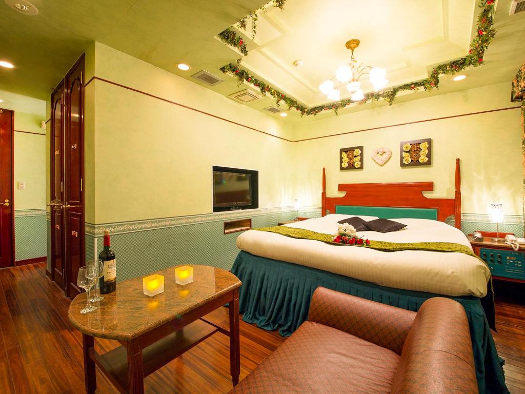 Postel nebo postele na pokoji v ubytování Hotel Gallery (Adult Only)