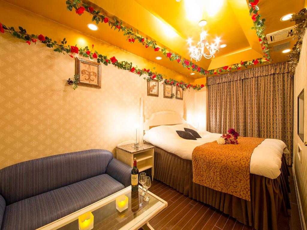Postel nebo postele na pokoji v ubytování Hotel Gallery (Adult Only)