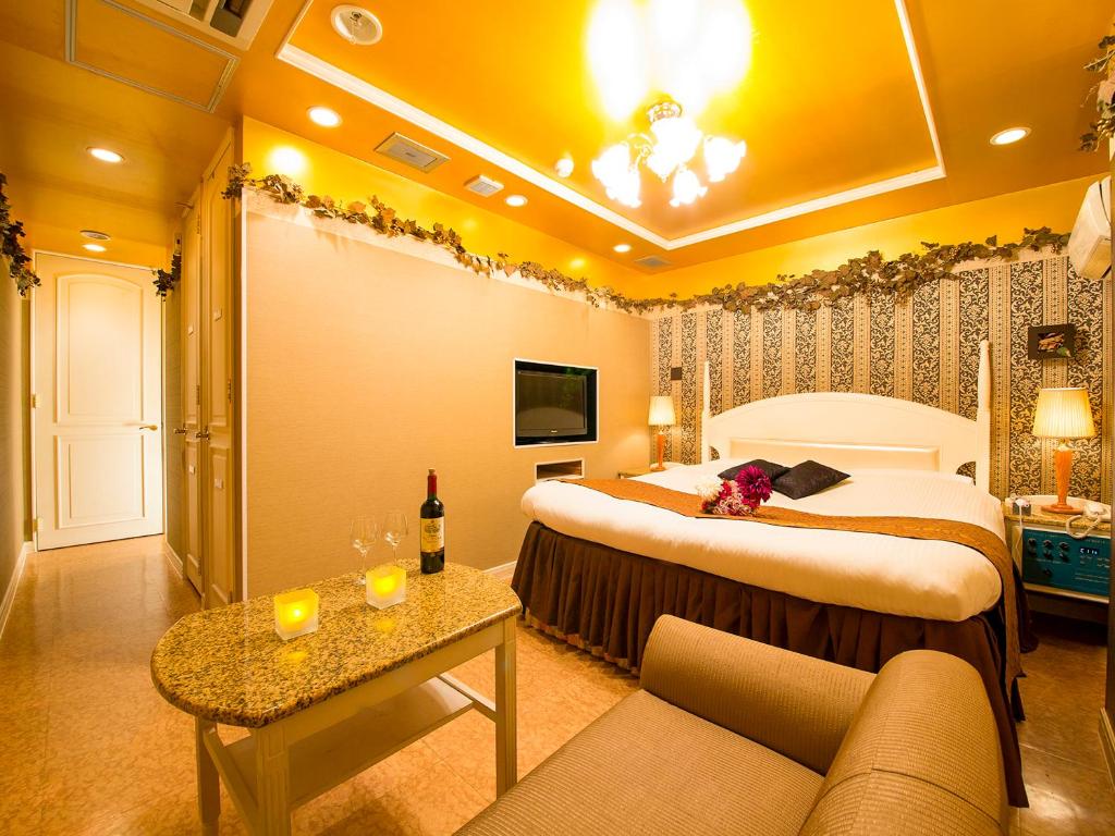 Postel nebo postele na pokoji v ubytování Hotel Gallery (Adult Only)