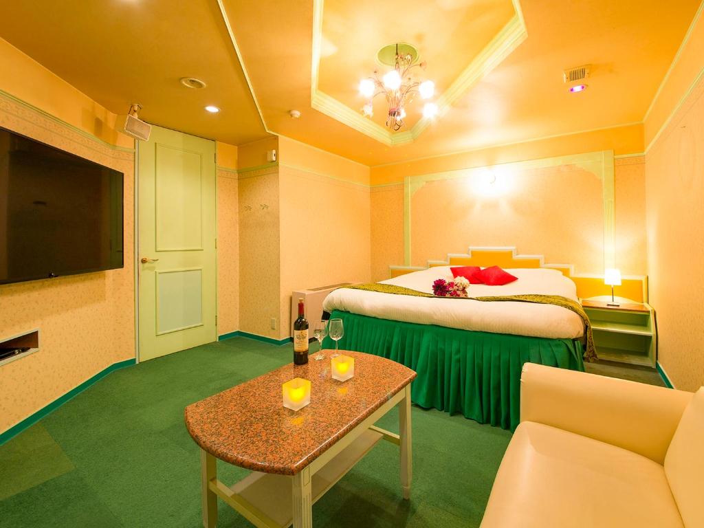 Postel nebo postele na pokoji v ubytování Hotel Gallery (Adult Only)
