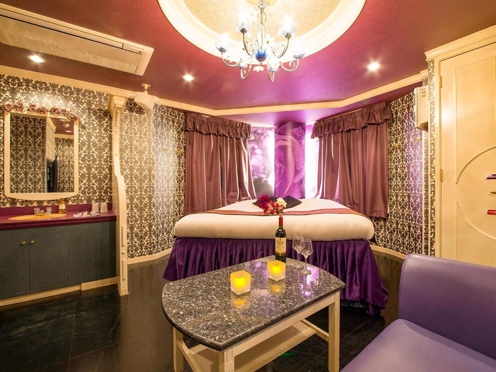 Postel nebo postele na pokoji v ubytování Hotel Gallery (Adult Only)