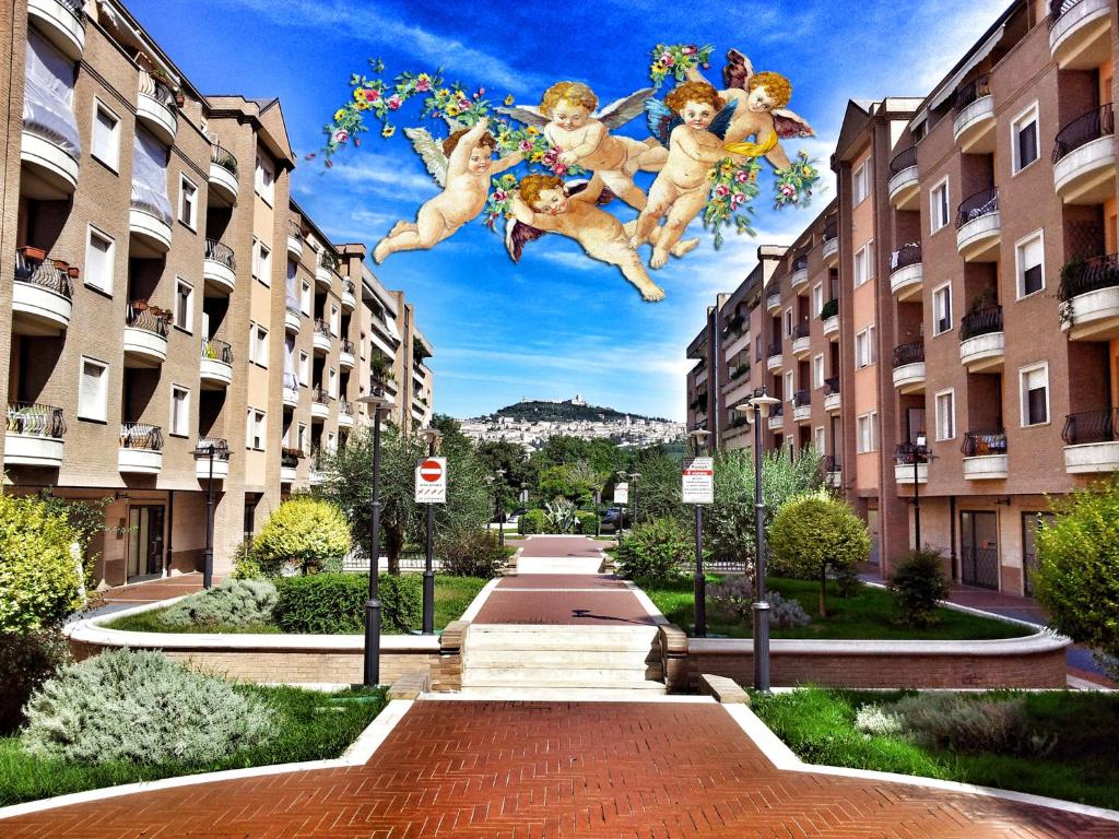 a mural of teddy bears jumping between two buildings at Assisi Casa degli Angeli in Assisi