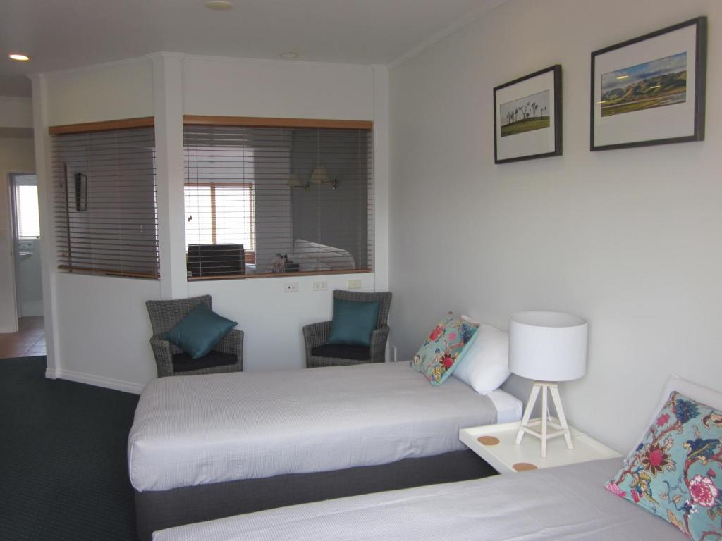 Postel nebo postele na pokoji v ubytování Beachfront Motel