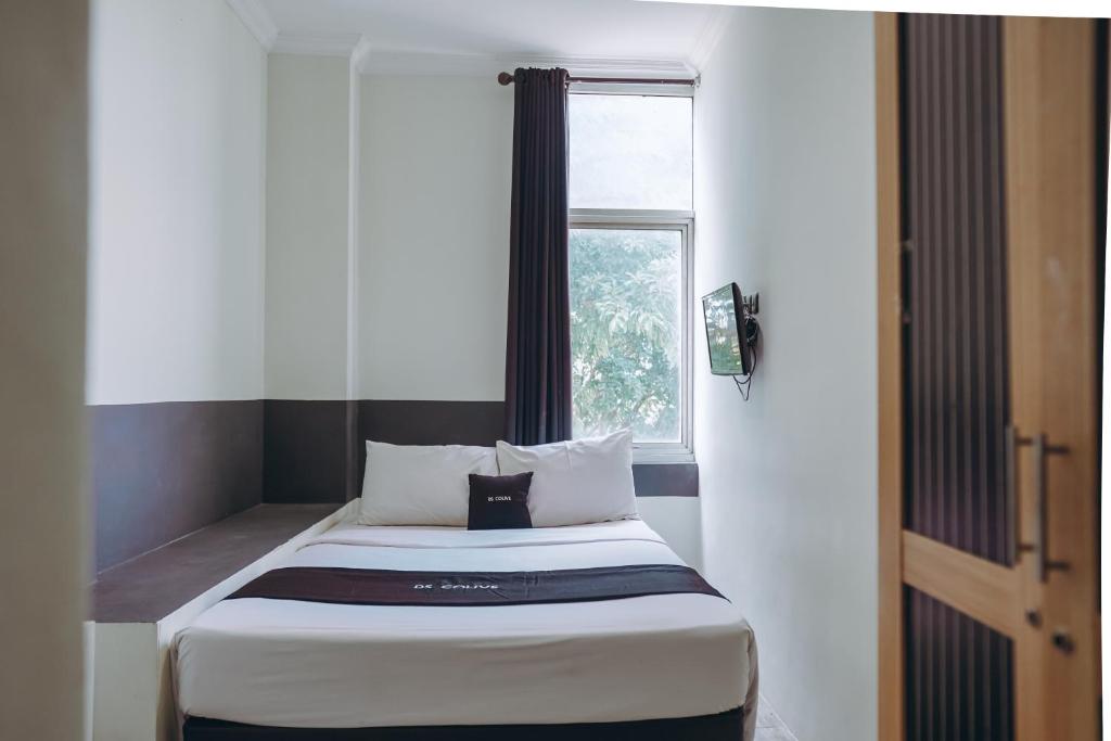 Un pat sau paturi într-o cameră la DS Colive Peterongan