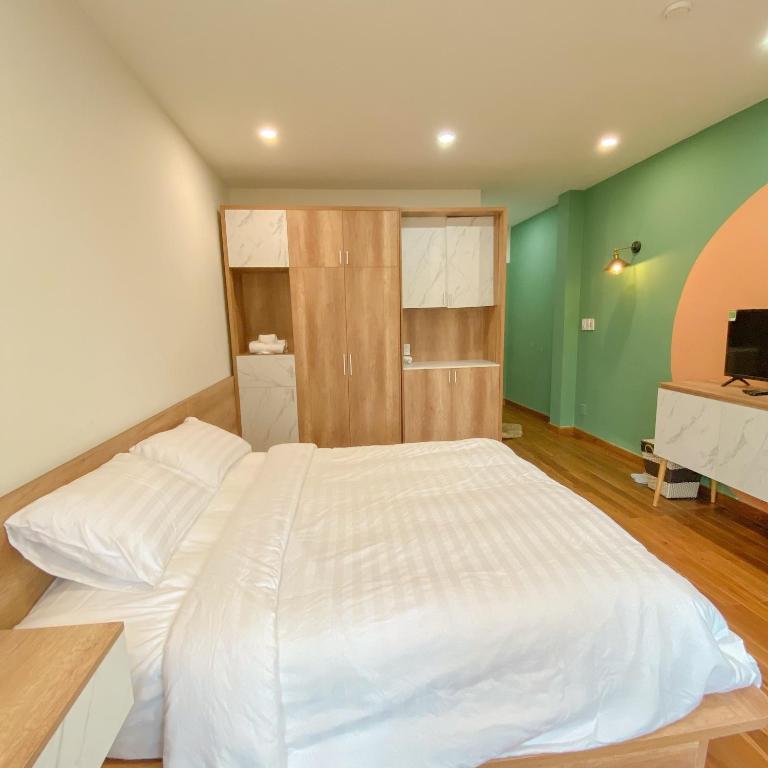 Postel nebo postele na pokoji v ubytování POTA Hotel & Apartment