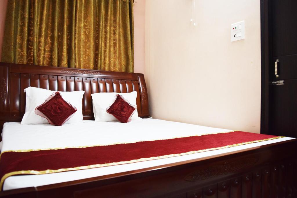 Postel nebo postele na pokoji v ubytování Hotel Avisha