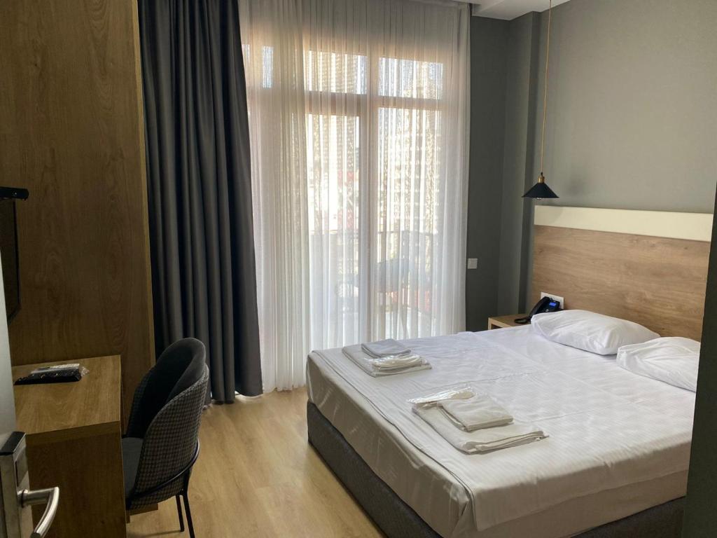 Postel nebo postele na pokoji v ubytování boulevard apartments