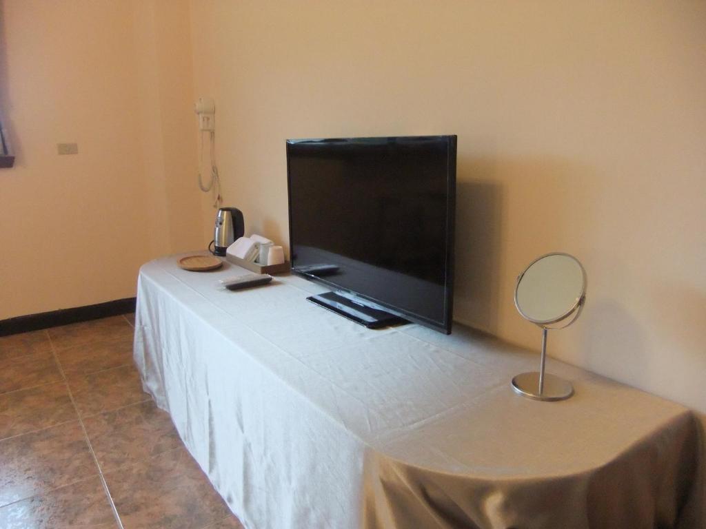 a flat screen tv sitting on top of a table at Jiufen Hui Ming Homestay in Jiufen