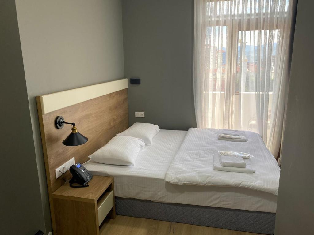 Postel nebo postele na pokoji v ubytování boulevard apartments