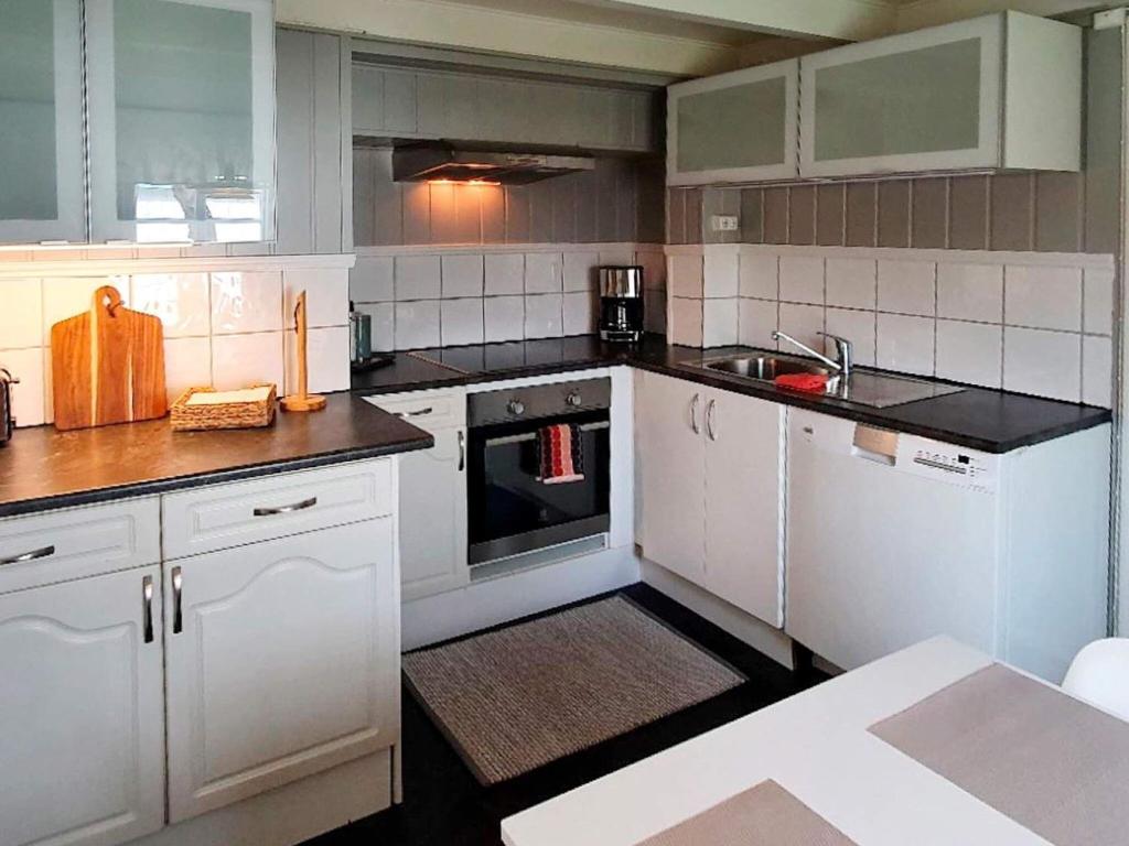 Kuchyň nebo kuchyňský kout v ubytování Holiday home bud III