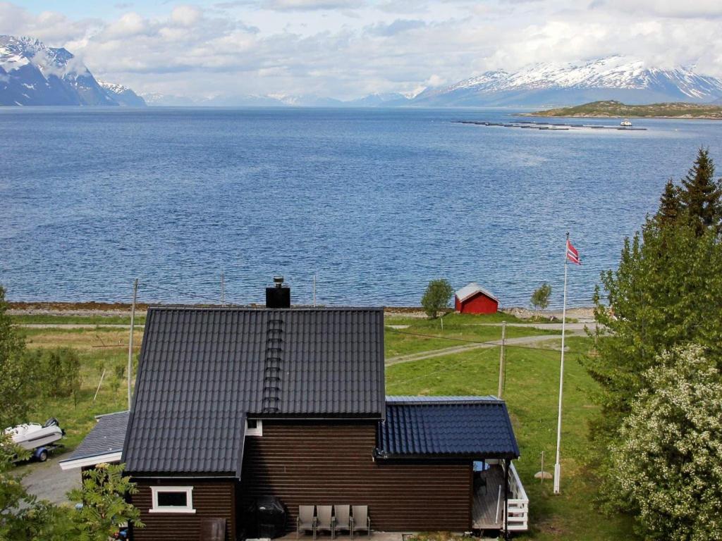 a house on the shore of a large body of water at 10 person holiday home in Lyngseidet in Lyngseidet