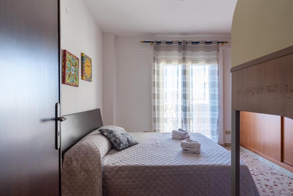 Posteľ alebo postele v izbe v ubytovaní Angy Apartment