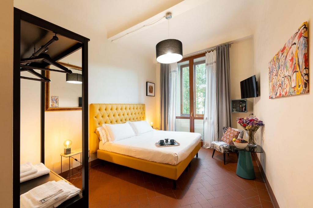 Postel nebo postele na pokoji v ubytování SPIRIT OF FLORENCE Boutique Rooms