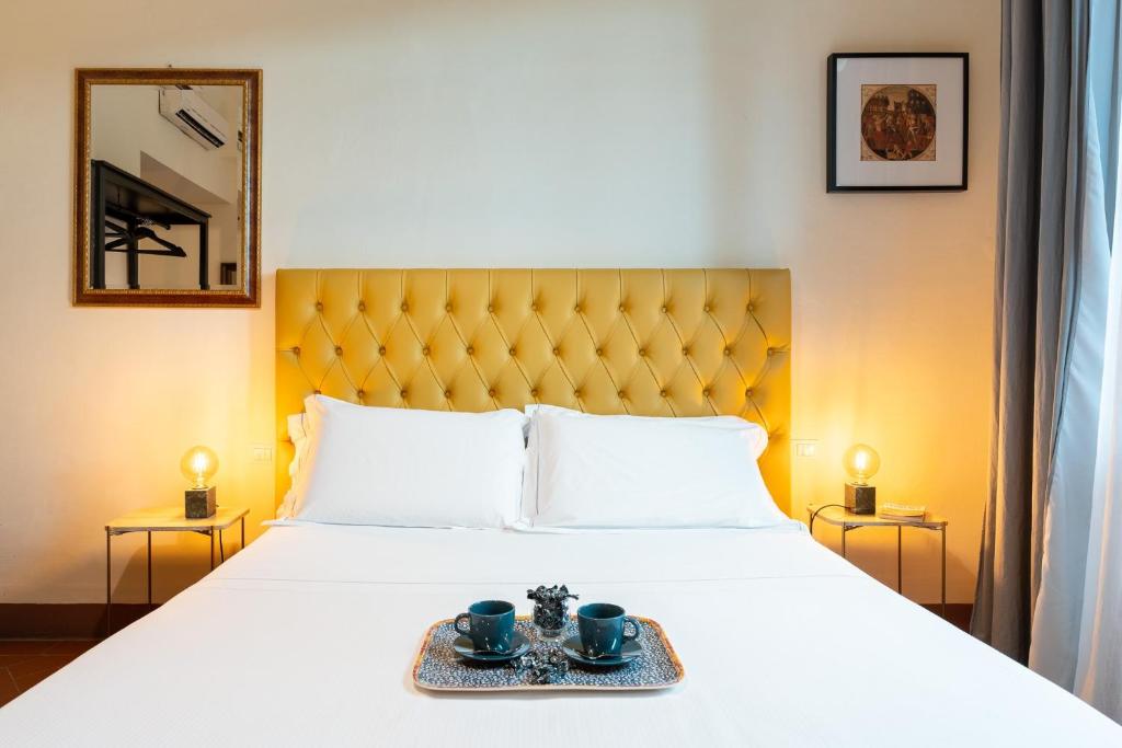 Postel nebo postele na pokoji v ubytování SPIRIT OF FLORENCE Boutique Rooms