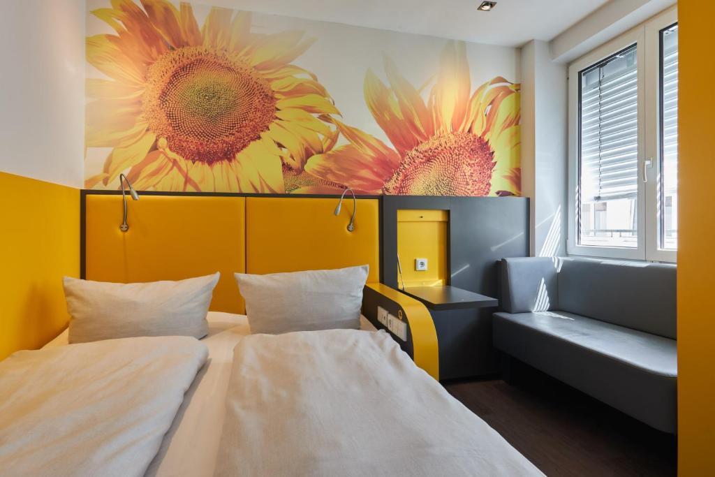 Postel nebo postele na pokoji v ubytování Buddy Hotel