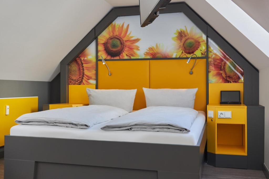 Postel nebo postele na pokoji v ubytování Buddy Hotel
