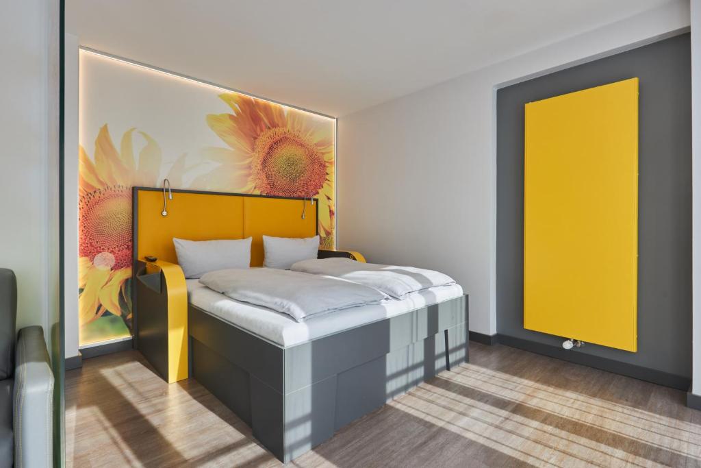 Postel nebo postele na pokoji v ubytování Buddy Hotel