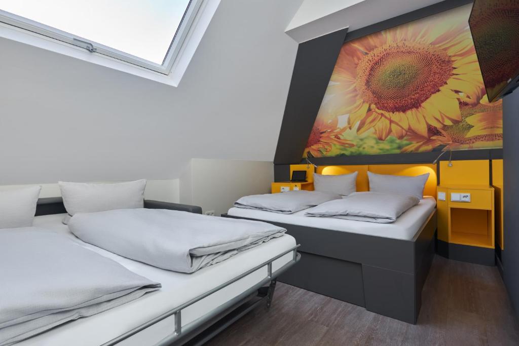 Postel nebo postele na pokoji v ubytování Buddy Hotel