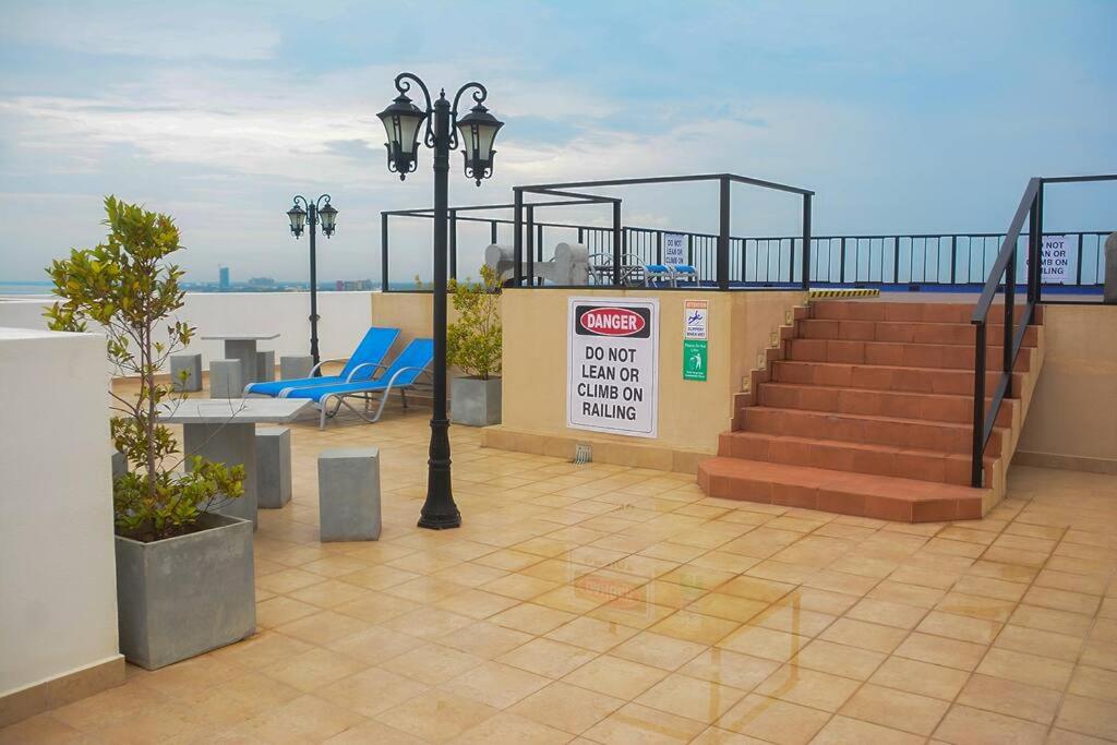 a building with stairs and blue chairs and a sign at Breathtaking Luxury in Negombo in Negombo