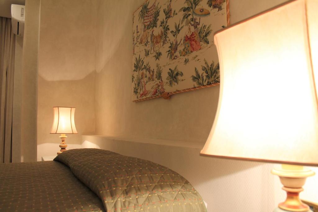 Postel nebo postele na pokoji v ubytování Hotel Parco dei Principi