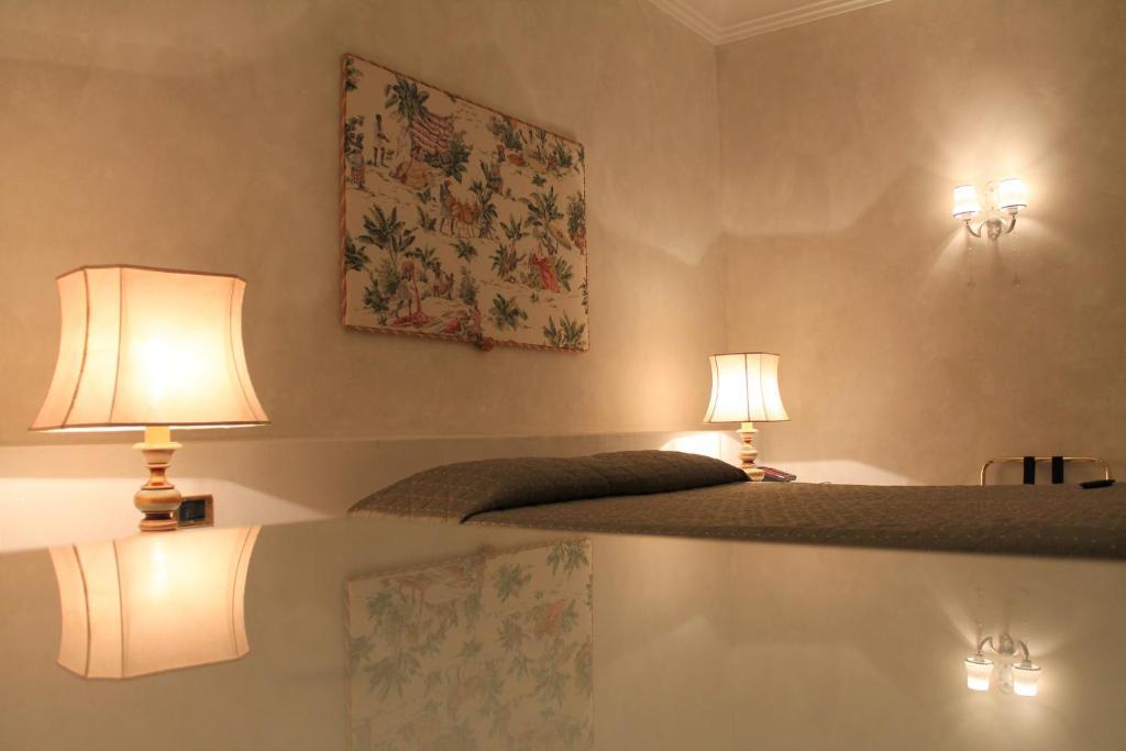 Postel nebo postele na pokoji v ubytování Hotel Parco dei Principi